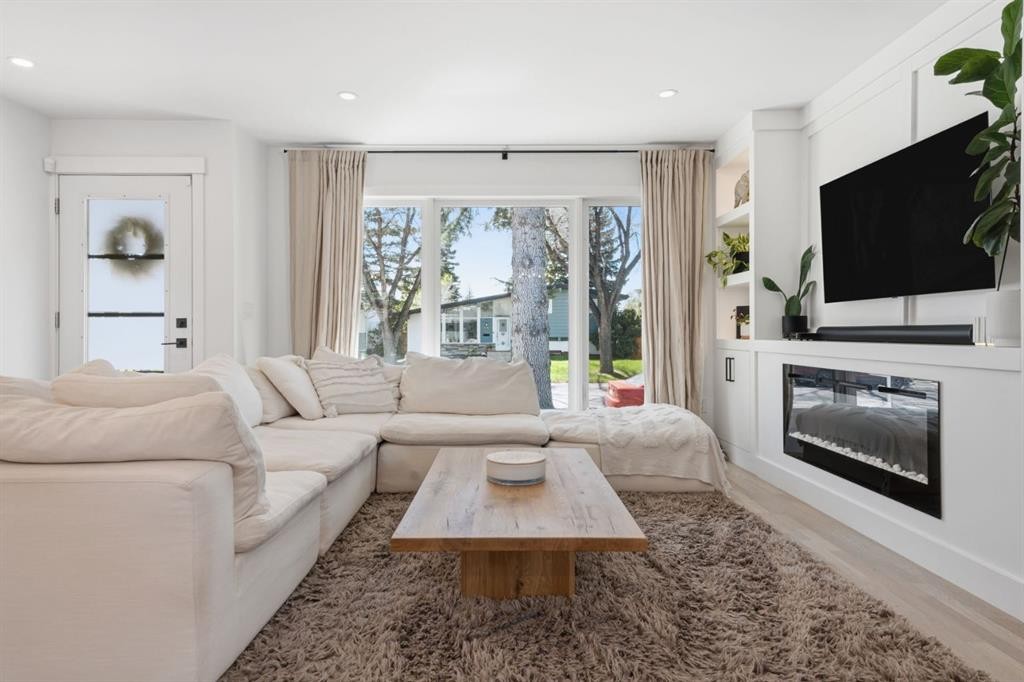87 Armstrong Crescent Se, Calgary, AB - Indoor Photo Showing Living Room With Fireplace