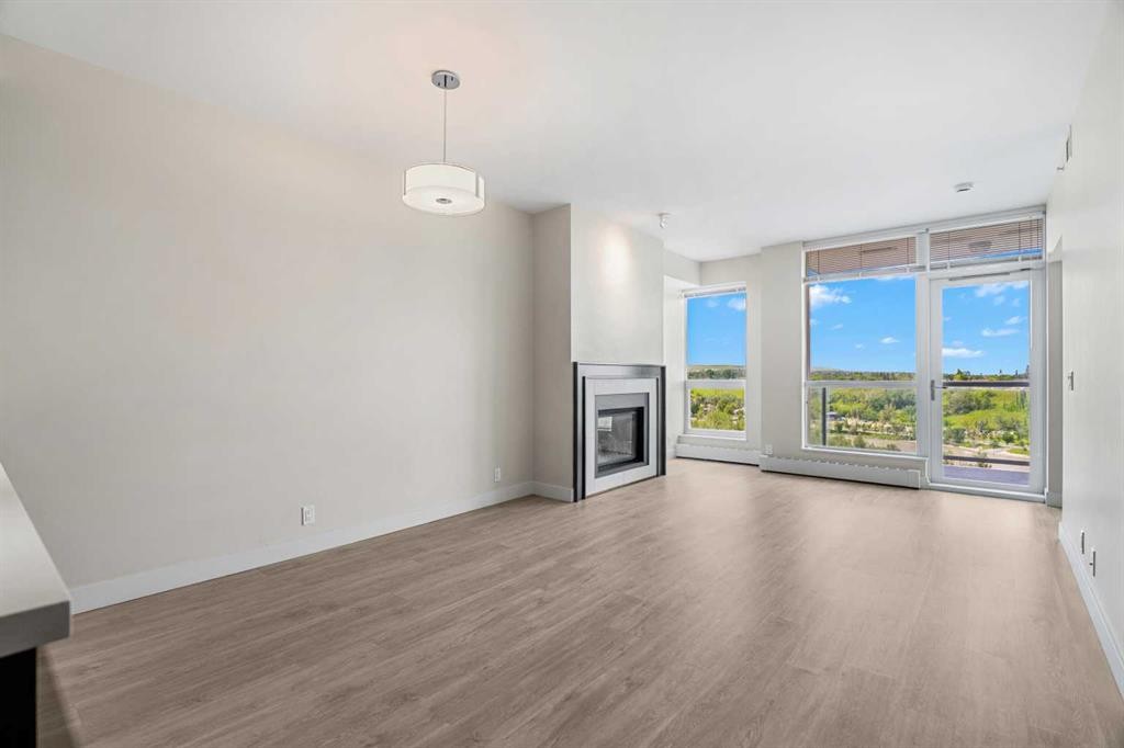 1712-222 Riverfront Avenue Sw, Calgary, AB - Indoor Photo Showing Living Room With Fireplace