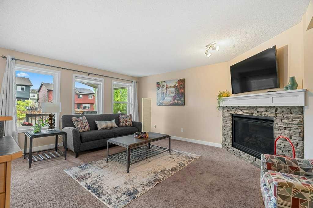 140 Panamount Circle Nw, Calgary, AB - Indoor Photo Showing Living Room With Fireplace