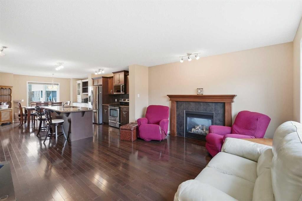 383 Fireside Place, Cochrane, AB - Indoor Photo Showing Living Room With Fireplace