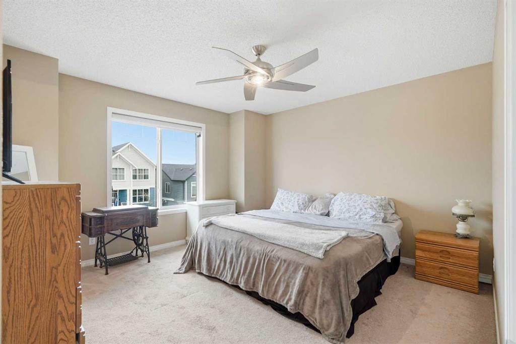 383 Fireside Place, Cochrane, AB - Indoor Photo Showing Bedroom