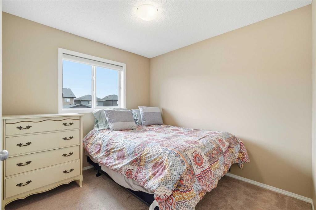 383 Fireside Place, Cochrane, AB - Indoor Photo Showing Bedroom