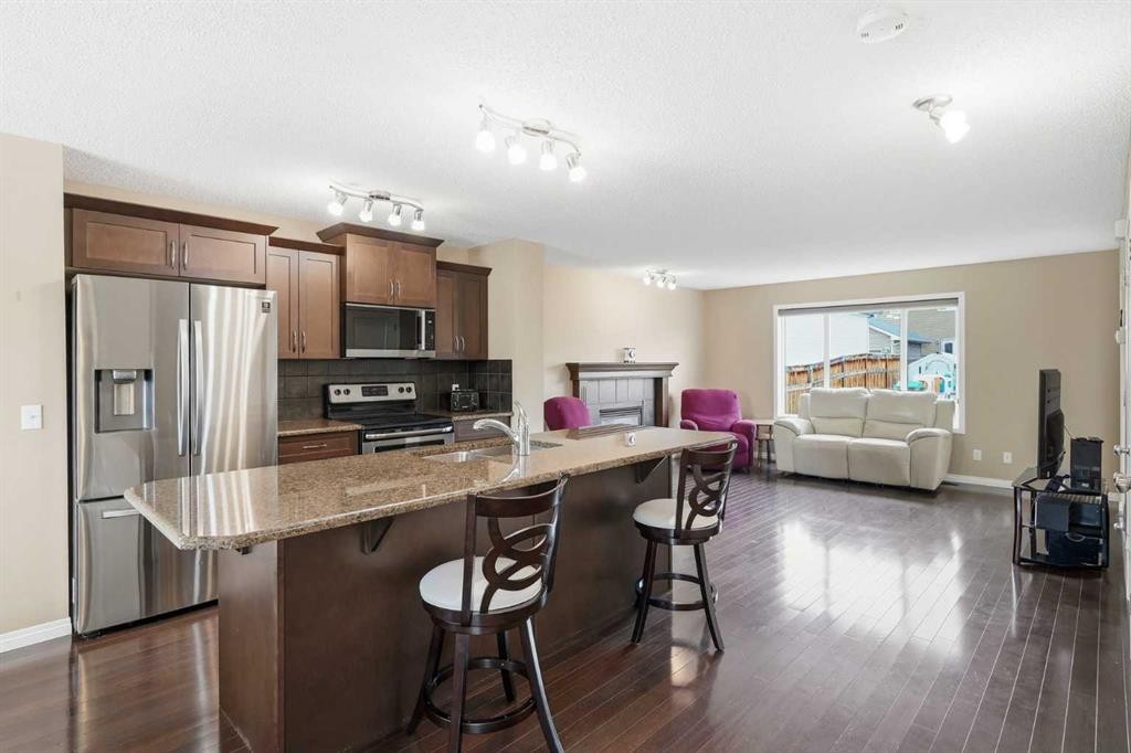 383 Fireside Place, Cochrane, AB - Indoor Photo Showing Kitchen With Stainless Steel Kitchen With Double Sink