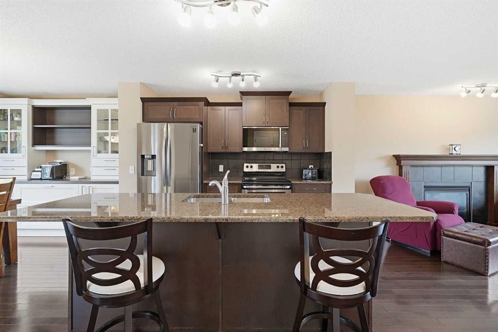 383 Fireside Place, Cochrane, AB - Indoor Photo Showing Kitchen With Stainless Steel Kitchen With Upgraded Kitchen