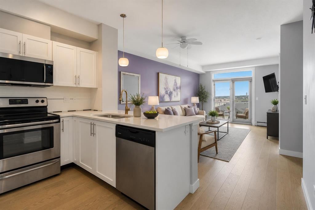 412-2300 Evanston Square Nw, Calgary, AB - Indoor Photo Showing Kitchen With Stainless Steel Kitchen With Double Sink