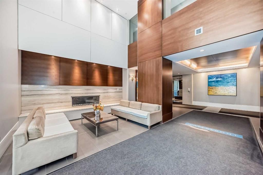 357-222 Riverfront Avenue Sw, Calgary, AB - Indoor Photo Showing Other Room With Fireplace