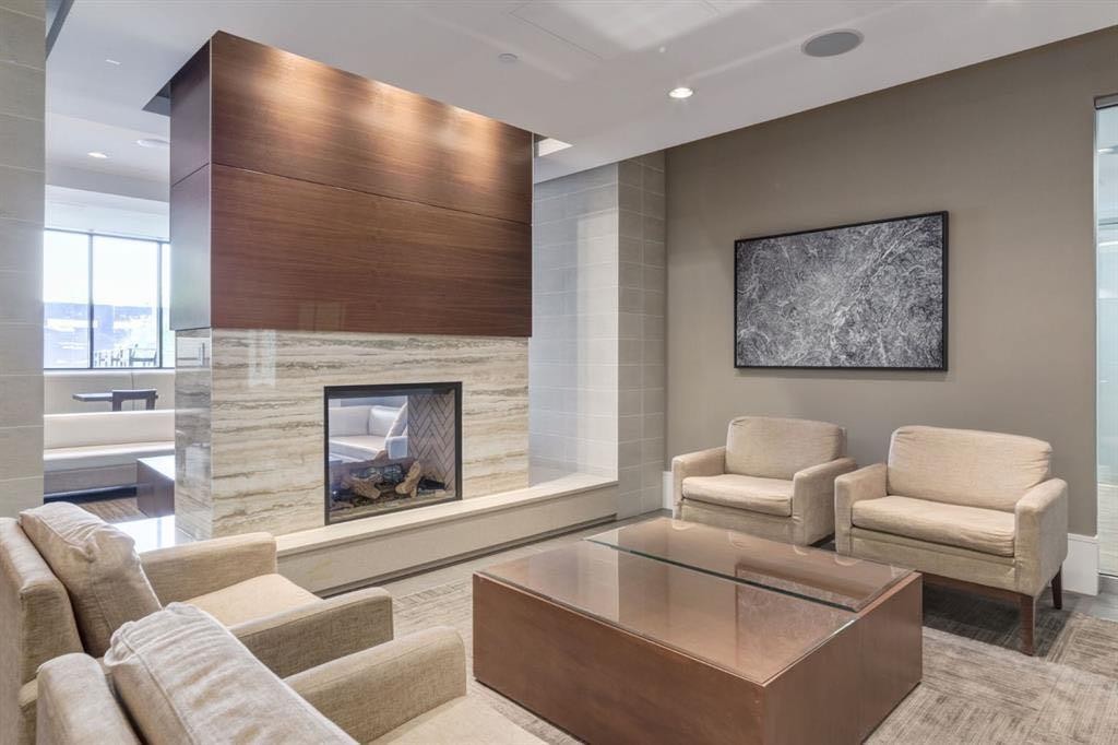 357-222 Riverfront Avenue Sw, Calgary, AB - Indoor Photo Showing Living Room With Fireplace