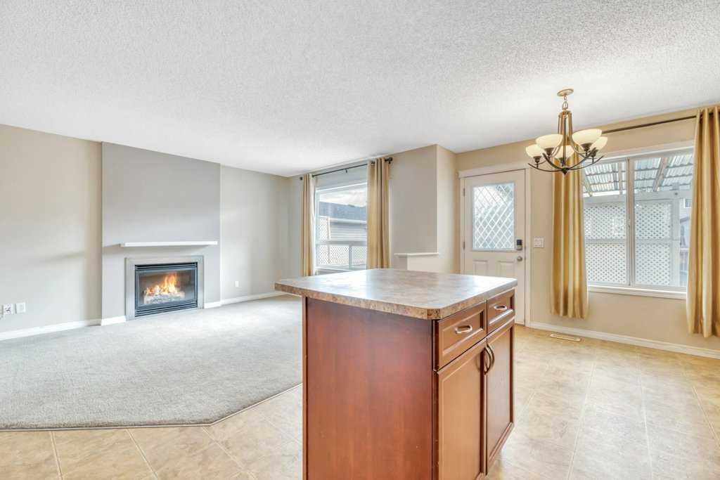 126 Covebrook Place Ne, Calgary, AB - Indoor Photo Showing Other Room With Fireplace