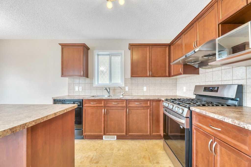 126 Covebrook Place Ne, Calgary, AB - Indoor Photo Showing Kitchen With Double Sink