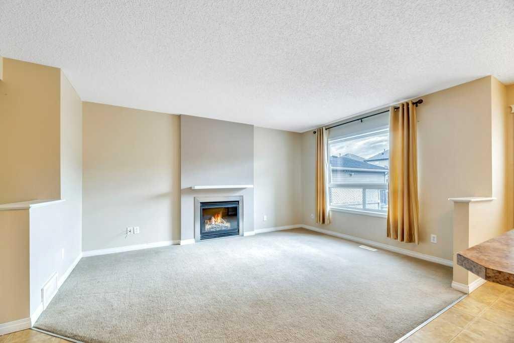 126 Covebrook Place Ne, Calgary, AB - Indoor Photo Showing Living Room With Fireplace
