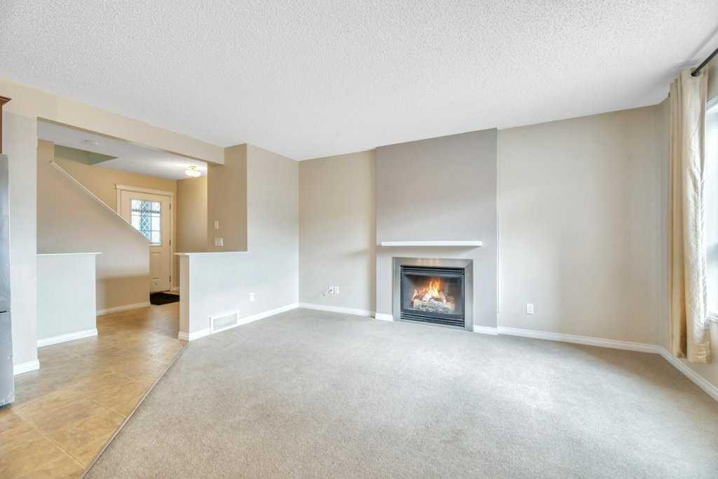 126 Covebrook Place Ne, Calgary, AB - Indoor Photo Showing Living Room With Fireplace
