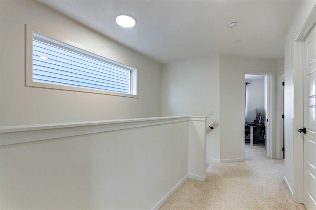 30 Creekside Manor Sw, Calgary, AB - Indoor Photo Showing Other Room