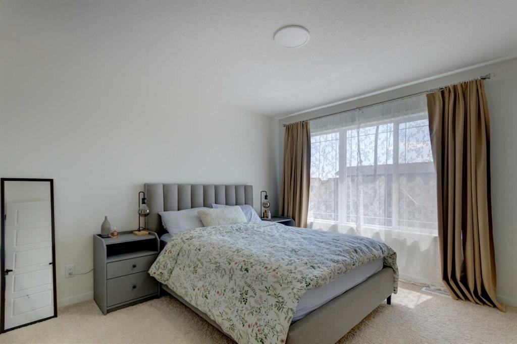 30 Creekside Manor Sw, Calgary, AB - Indoor Photo Showing Bedroom