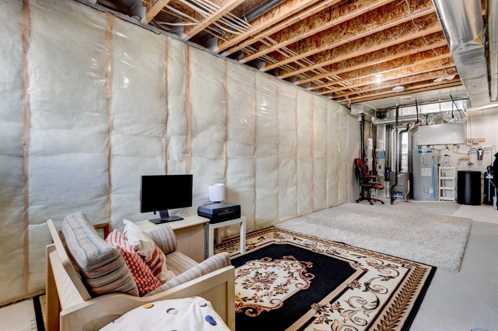 30 Creekside Manor Sw, Calgary, AB - Indoor Photo Showing Basement
