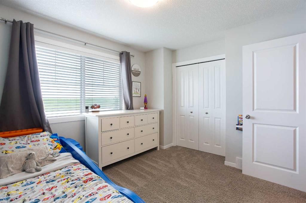 88 New Brighton Point Se, Calgary, AB - Indoor Photo Showing Bedroom