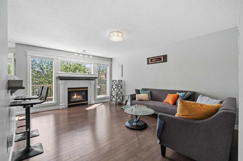 107 Edgebrook Circle Nw, Calgary, AB - Indoor Photo Showing Living Room With Fireplace