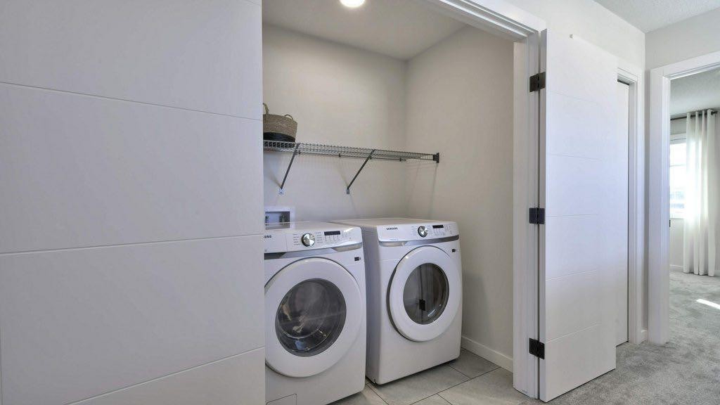 311 Wolf River Drive Se, Calgary, AB - Indoor Photo Showing Laundry Room