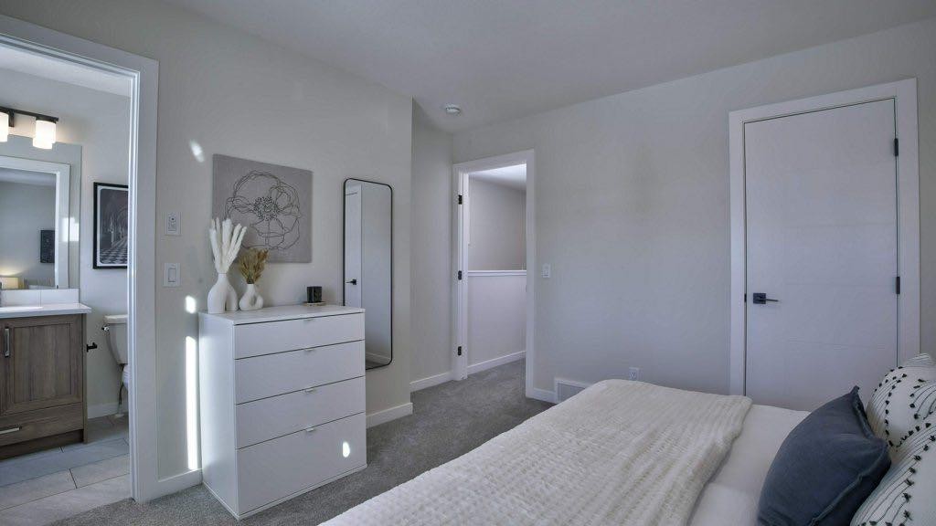 311 Wolf River Drive Se, Calgary, AB - Indoor Photo Showing Bedroom