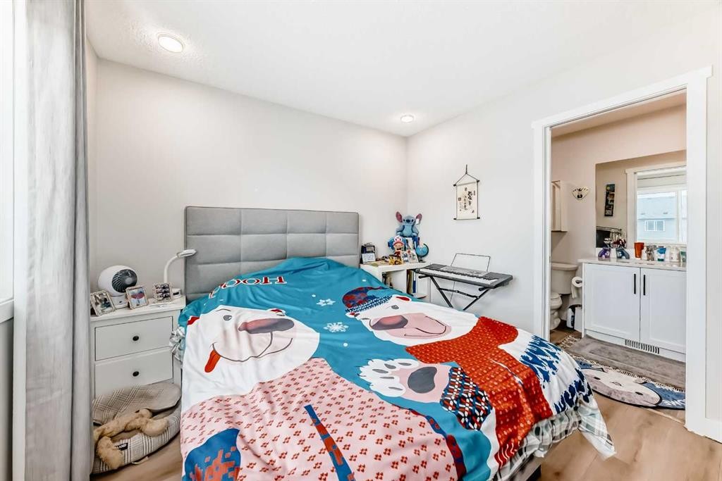 16 Carringvue Way Nw, Calgary, AB - Indoor Photo Showing Bedroom