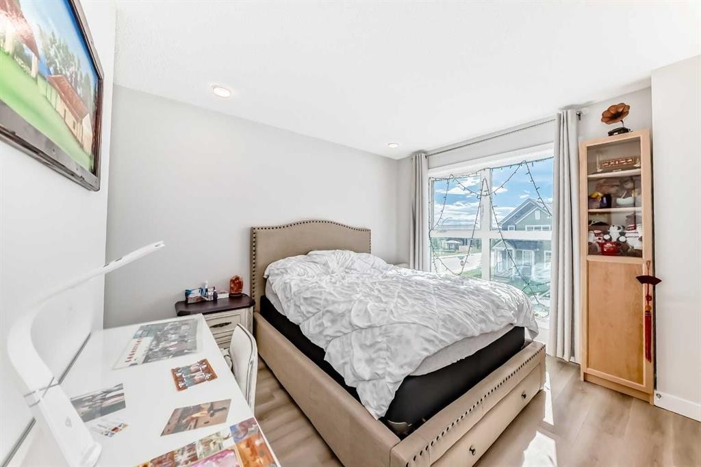16 Carringvue Way Nw, Calgary, AB - Indoor Photo Showing Bedroom