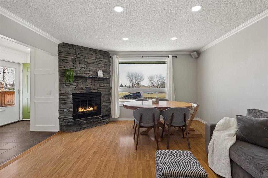 8011 Huntington Street Ne, Calgary, AB - Indoor Photo Showing Living Room With Fireplace