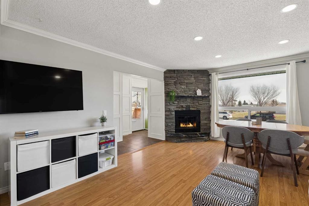 8011 Huntington Street Ne, Calgary, AB - Indoor Photo Showing Living Room With Fireplace