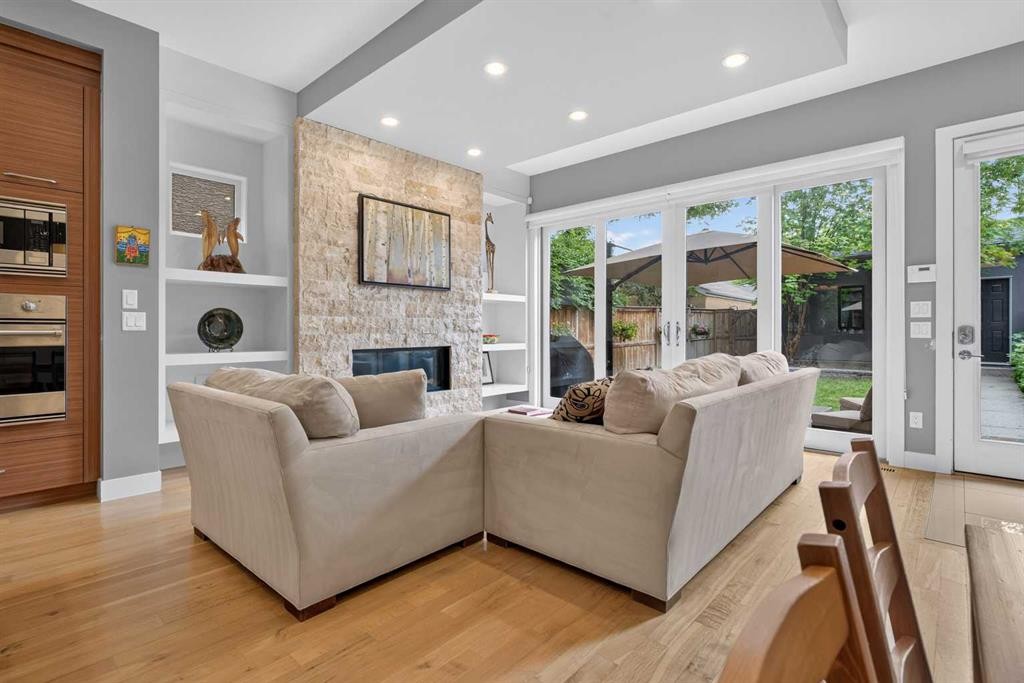 2219 2 Avenue Nw, Calgary, AB - Indoor Photo Showing Living Room With Fireplace