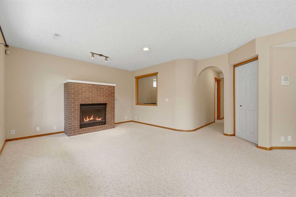 67 Sienna Heights Way Sw, Calgary, AB - Indoor Photo Showing Other Room With Fireplace