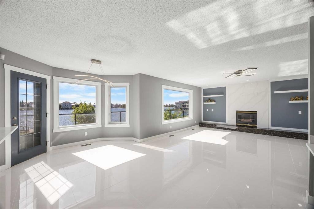 151 Coral Shores Landing Ne, Calgary, AB - Indoor With Fireplace