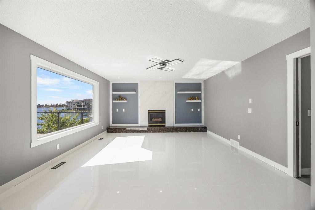 151 Coral Shores Landing Ne, Calgary, AB - Indoor With Fireplace