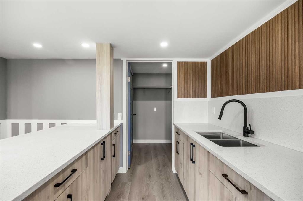 151 Coral Shores Landing Ne, Calgary, AB - Indoor Photo Showing Kitchen With Double Sink
