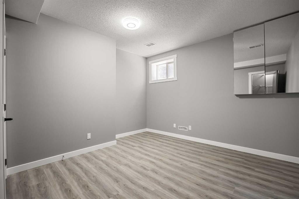 151 Coral Shores Landing Ne, Calgary, AB - Indoor Photo Showing Other Room