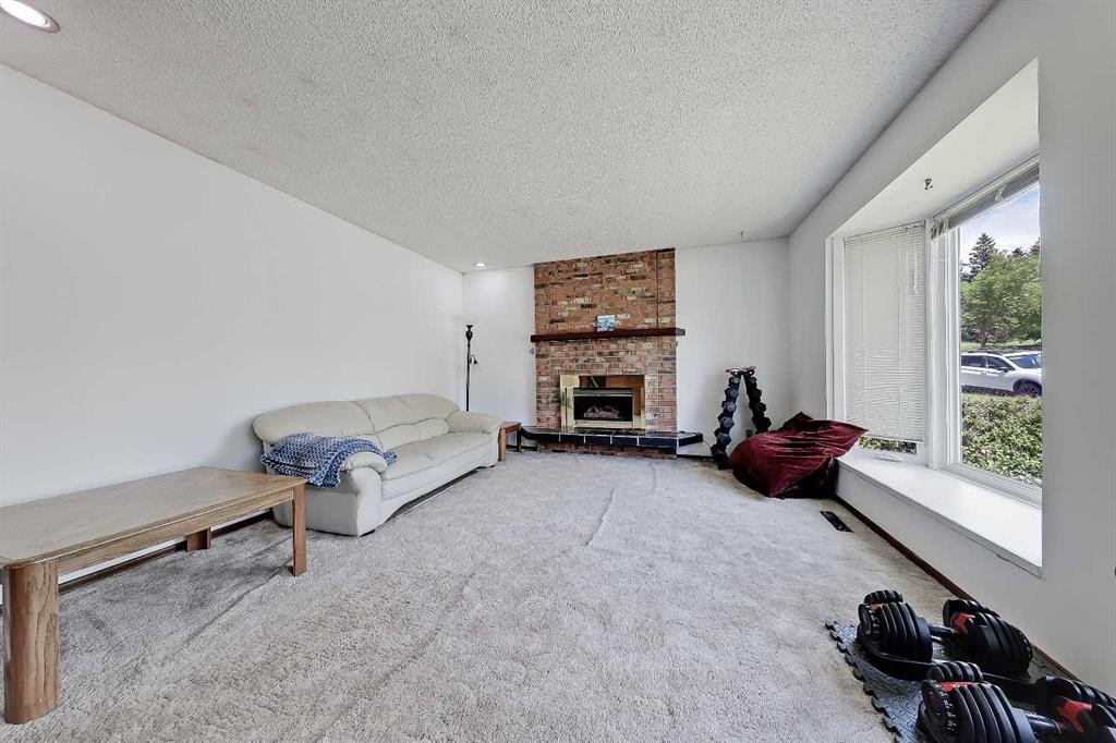 4315 Charleswood Drive Nw, Calgary, AB - Indoor Photo Showing Other Room With Fireplace
