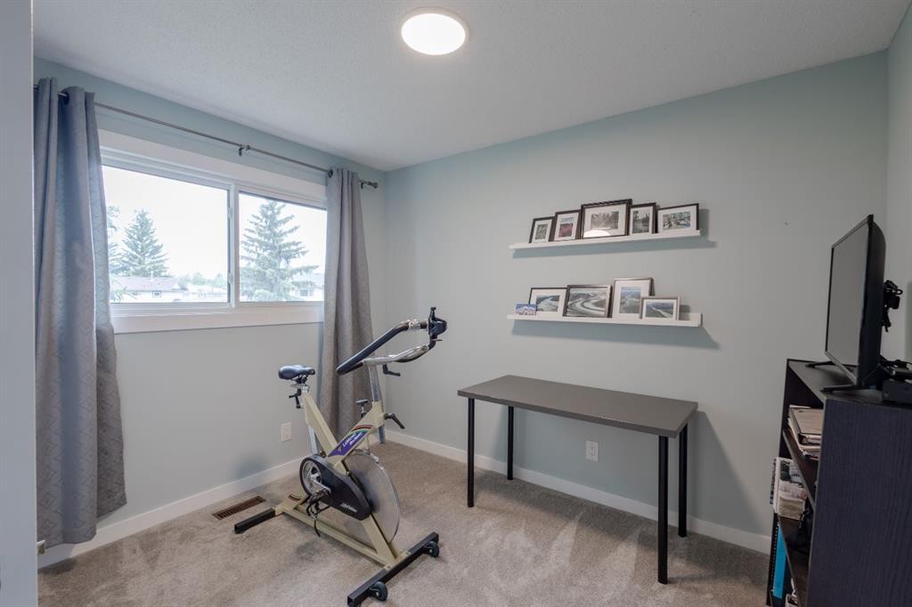 119 Midland Place Se, Calgary, AB - Indoor Photo Showing Gym Room