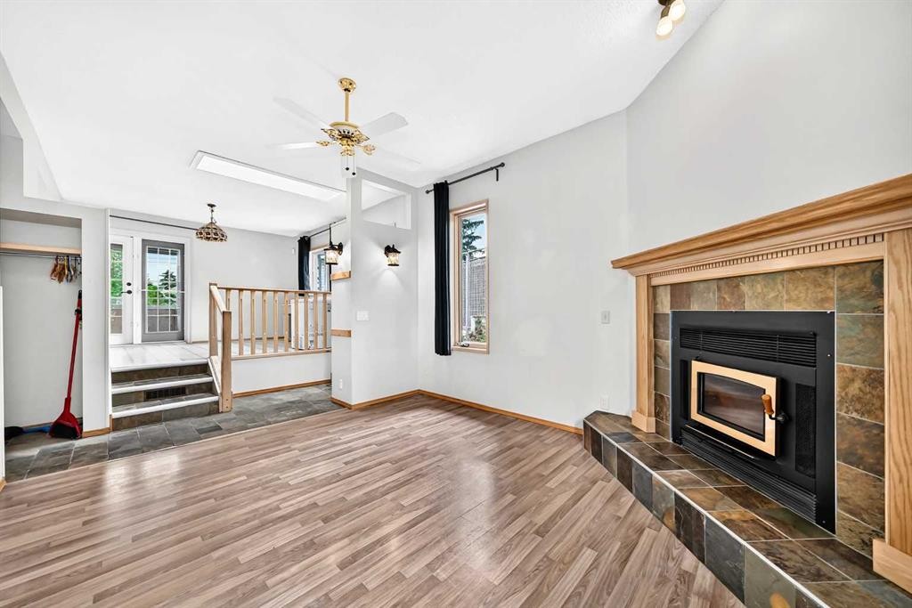 42 Cardiff Drive Nw, Calgary, AB - Indoor Photo Showing Other Room With Fireplace