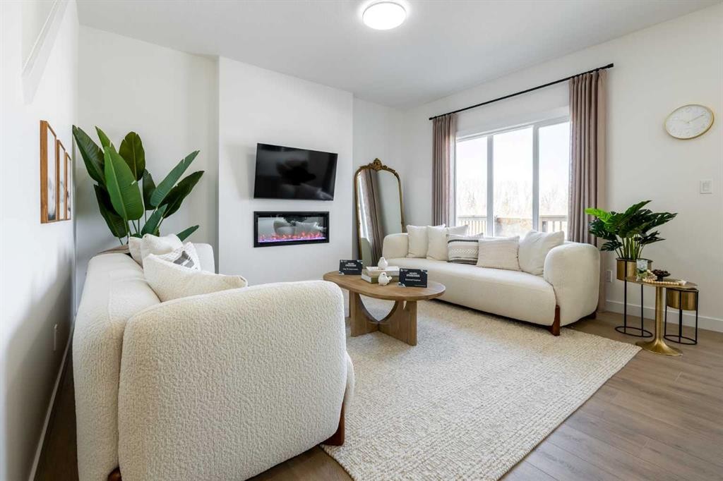 500 Savanna Crescent Ne, Calgary, AB - Indoor Photo Showing Living Room With Fireplace