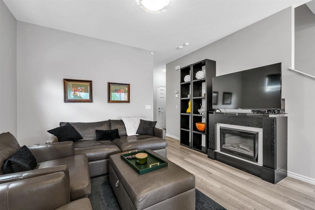 72 Legacy Mews Se, Calgary, AB - Indoor Photo Showing Living Room With Fireplace