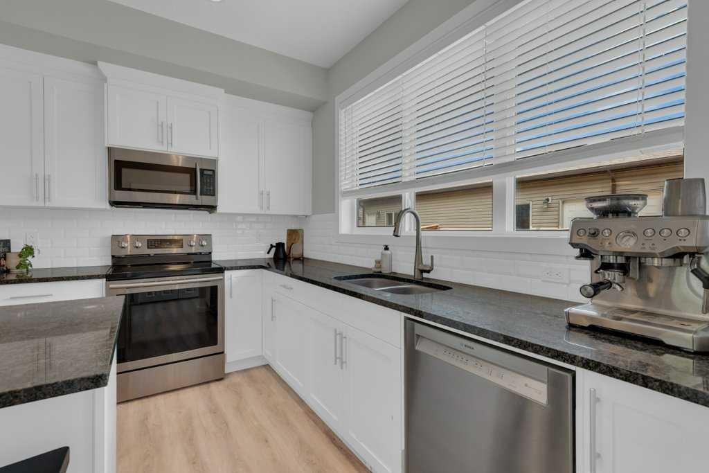 1293 Legacy Circle Se, Calgary, AB - Indoor Photo Showing Kitchen With Double Sink