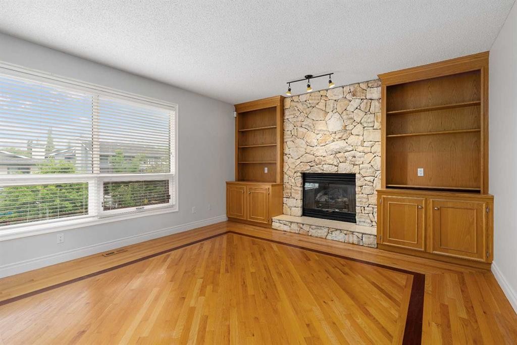 112 Hawkford Crescent Nw, Calgary, AB - Indoor Photo Showing Living Room With Fireplace