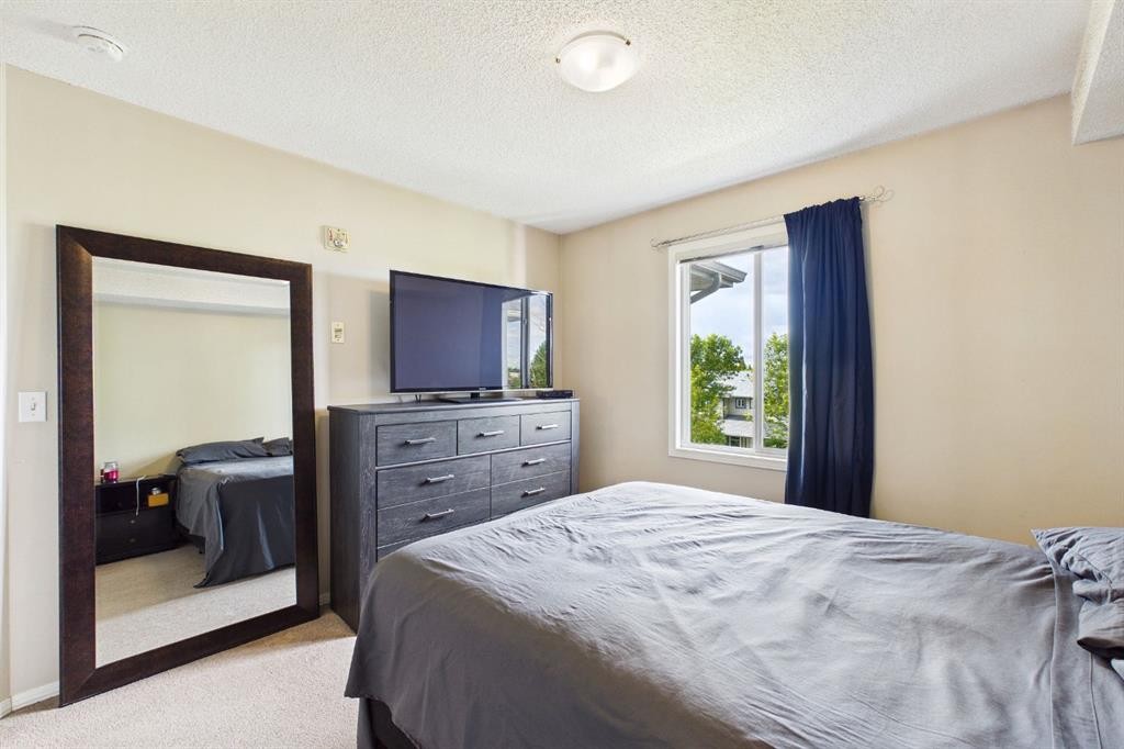 2305-2371 Eversyde Avenue Sw, Calgary, AB - Indoor Photo Showing Bedroom