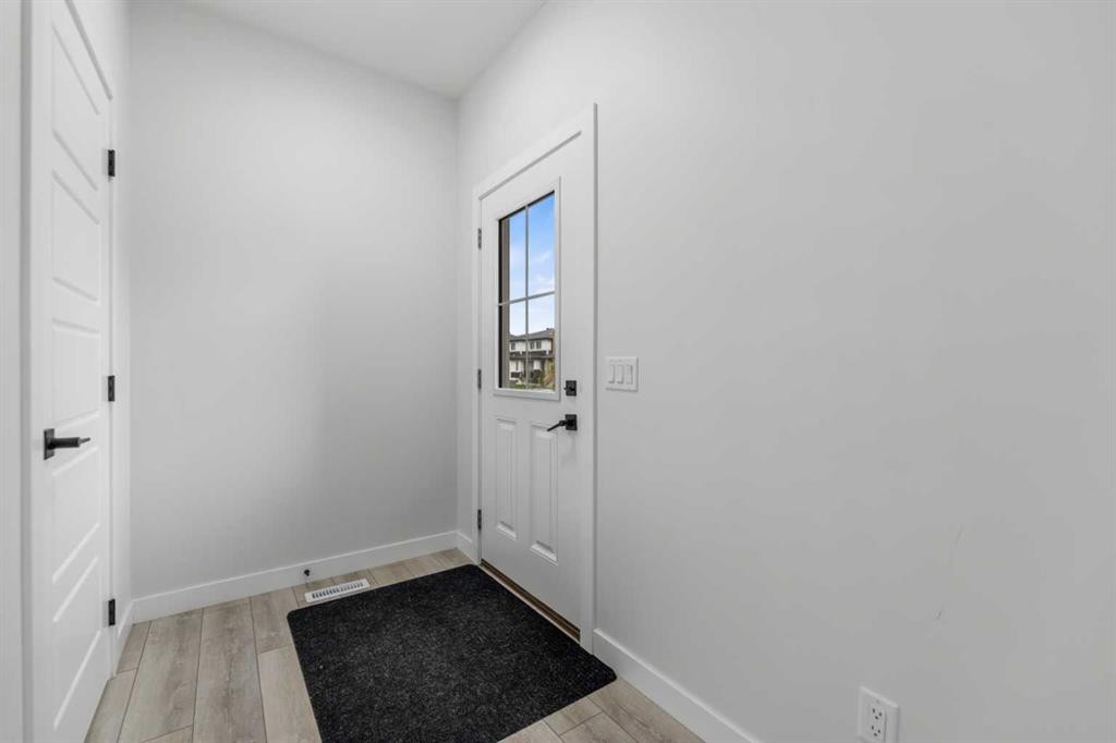 150 Ambleton Drive Nw, Calgary, AB - Indoor Photo Showing Other Room