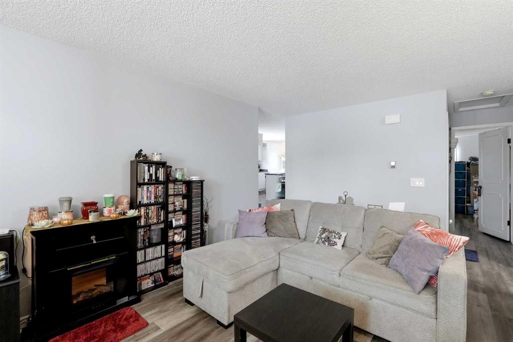 40 Mckerrell Close Se, Calgary, AB - Indoor Photo Showing Living Room With Fireplace