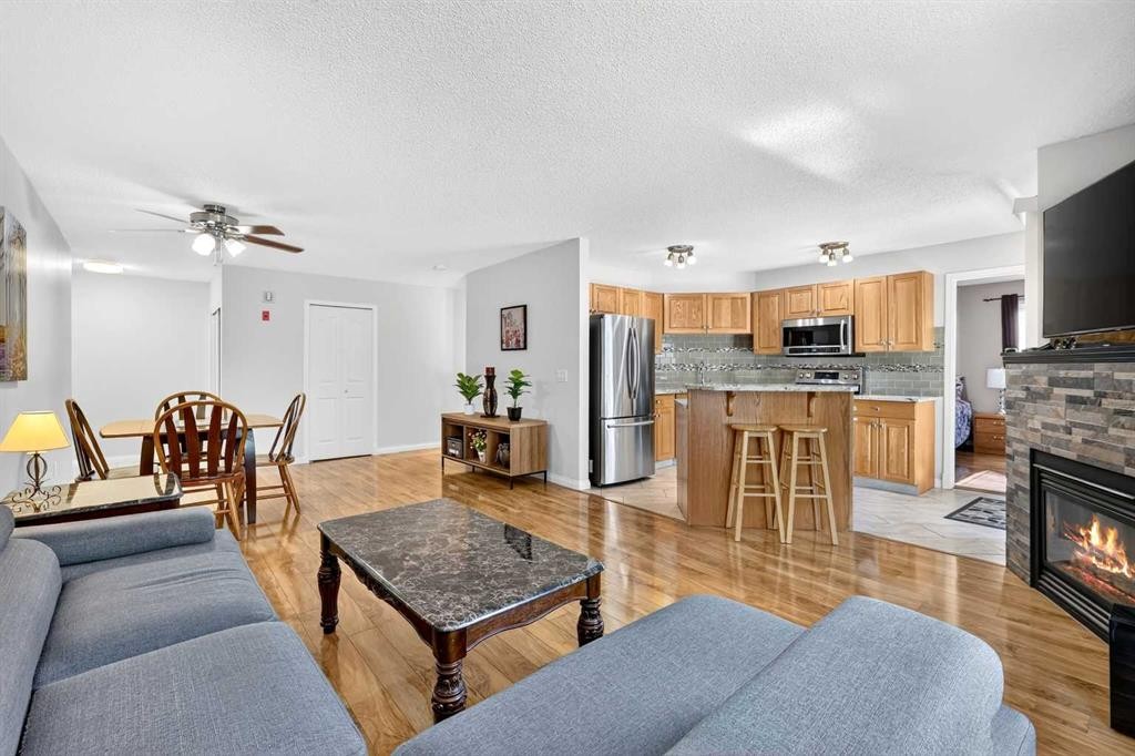 105-5105 Valleyview Park Se, Calgary, AB - Indoor Photo Showing Living Room With Fireplace