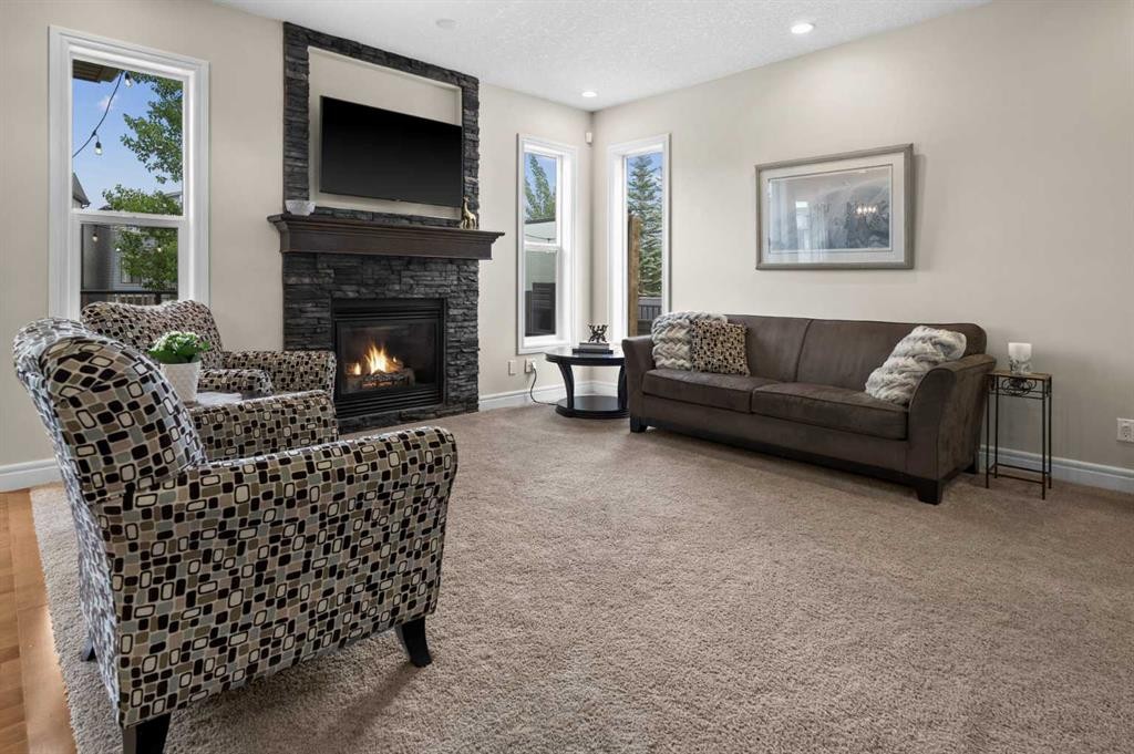 144 Silverado Skies Manor Sw, Calgary, AB - Indoor Photo Showing Living Room With Fireplace