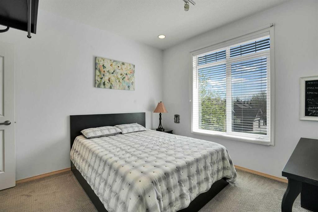 6 Discovery Woods Villas Sw, Calgary, AB - Indoor Photo Showing Bedroom