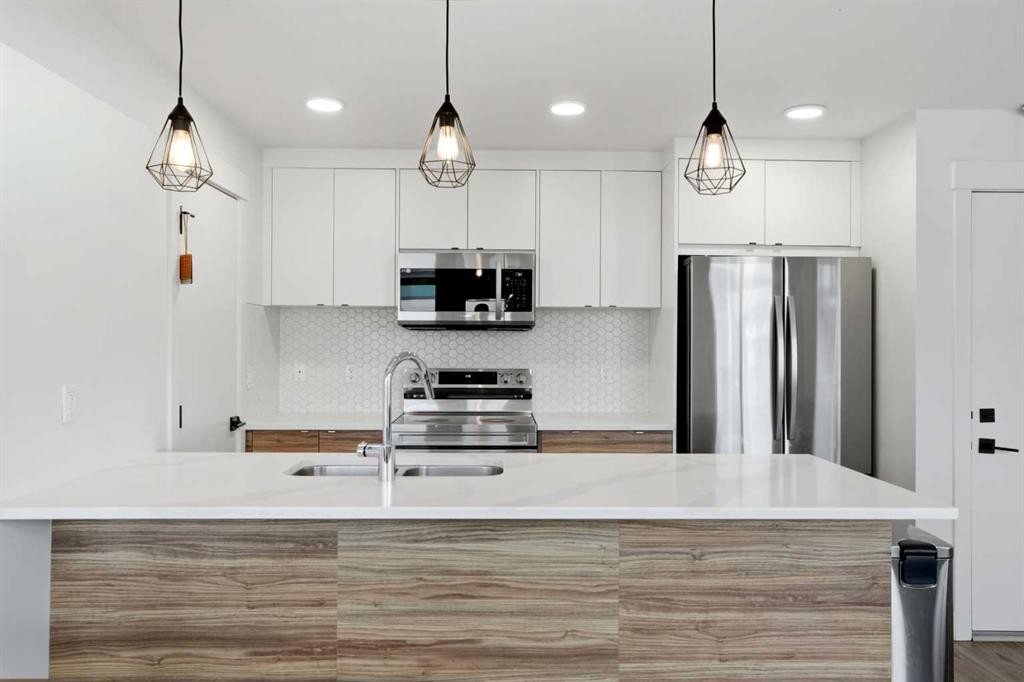 603-10060 46 Street Ne, Calgary, AB - Indoor Photo Showing Kitchen With Double Sink With Upgraded Kitchen