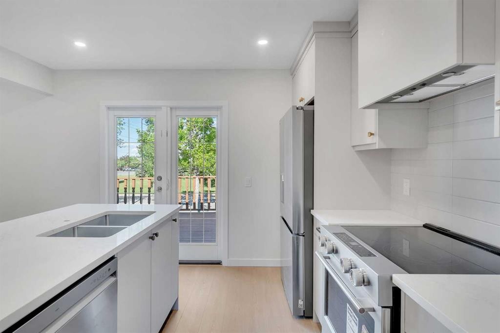 8059 Huntington Street Ne, Calgary, AB - Indoor Photo Showing Kitchen With Stainless Steel Kitchen With Double Sink