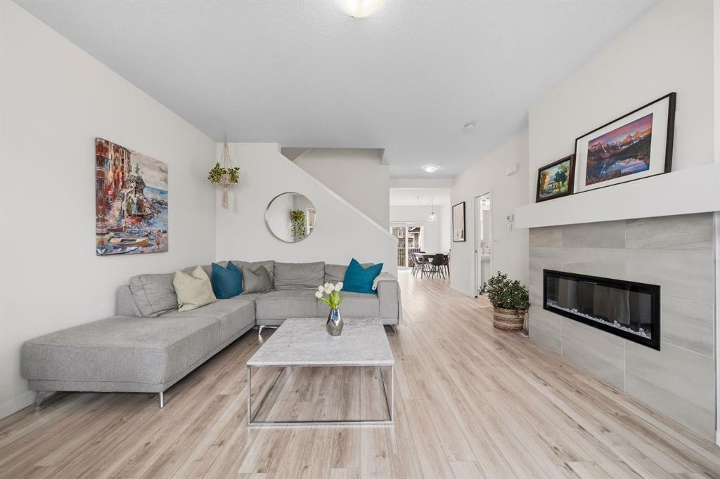 418 Copperstone Manor Se, Calgary, AB - Indoor Photo Showing Living Room With Fireplace