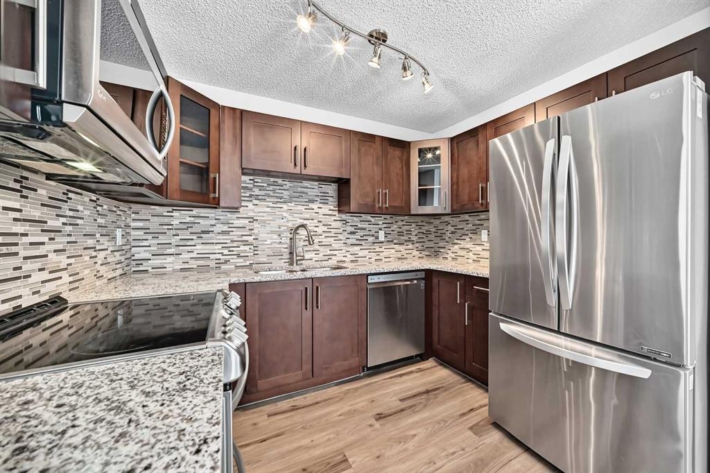 91 Cedarwood Hill Sw, Calgary, AB - Indoor Photo Showing Kitchen With Stainless Steel Kitchen With Upgraded Kitchen