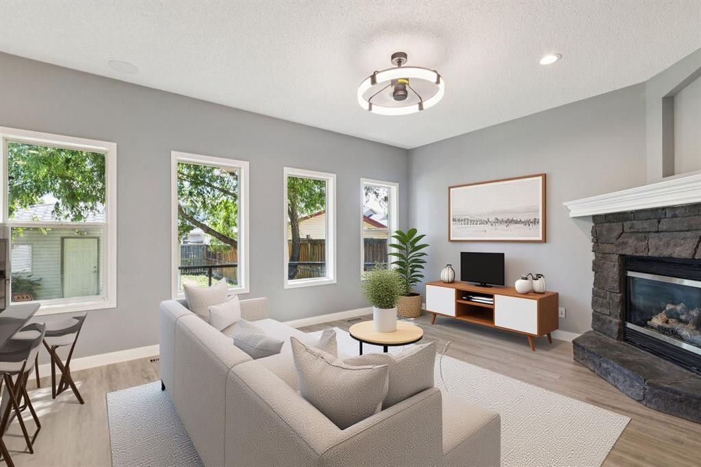 137 Prestwick Mews Se, Calgary, AB - Indoor Photo Showing Living Room With Fireplace